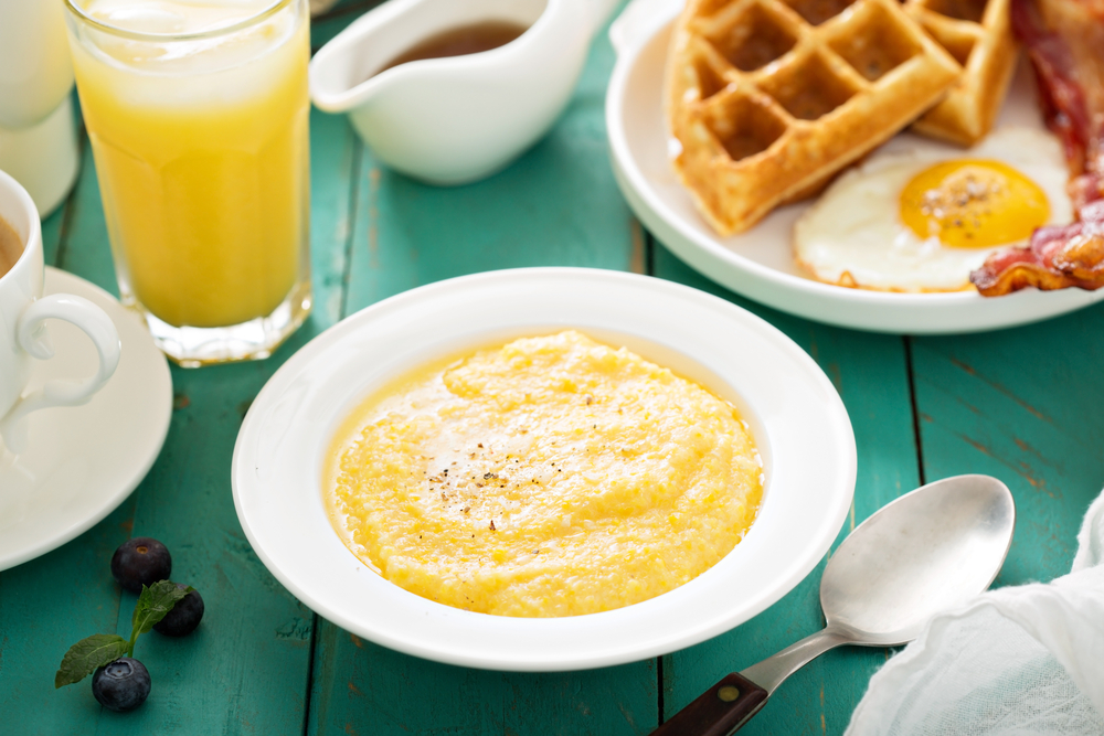 Cheesy,Grits,With,Butter,In,A,White,Bowl,For,Breakfast