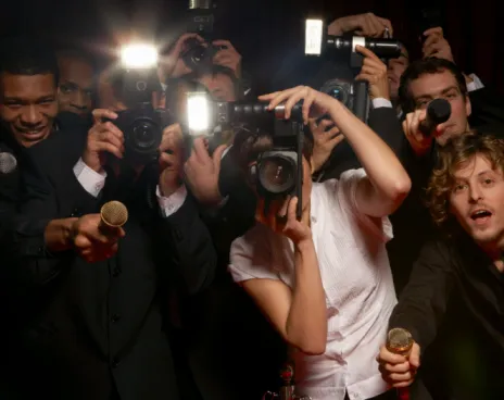 Paparazzi photographers and television reporters at celebrity event
