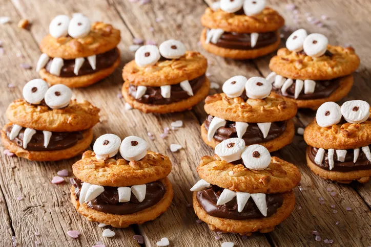 Toothed monsters of cookies close-up on a table for Halloween. horizontal