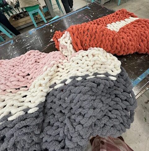 Two Chunky Knit Blankets on a table - AR Workshop Evans closing